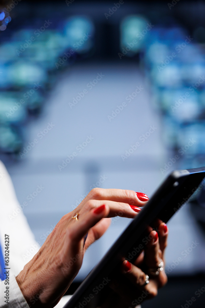 Poster capable admin using tablet to make sure data remains shielded from security hindrances, safeguarding