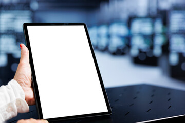 Close up shot of mock up tablet used by engineer in high tech location delivering immense computing...
