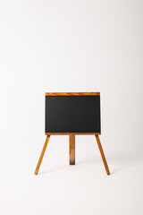 Black sign in wooden frame and copy space on white background