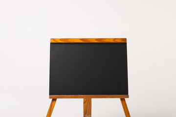 Black sign in wooden frame and copy space on white background