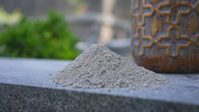 ashes after cremation, very close-up on the background of the urn
