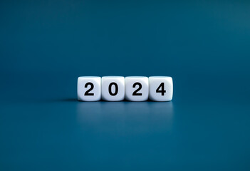 The calendar year 2024 with goal and success concept. 2024, new year number on white cube blocks...