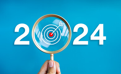 Happy new year 2024 with business concept banner. The big white 2024 year number with target dart...