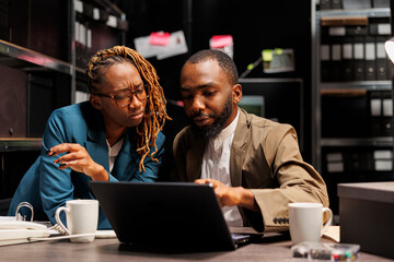 African american criminologists colleagues conducting investigation research in detective office....