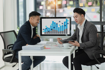 Technology and financial advisory services concert. Business teamwork and working on digital laptop computer with advisor showing plan of investment to clients at table office. Digital marketing.