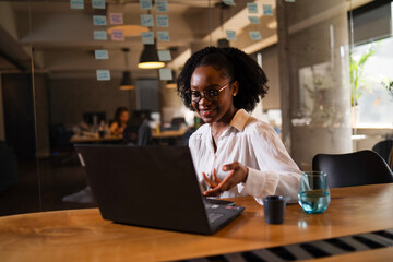 Black businesswoman working on laptop. Portrait of beautiful businesswoman in the office.