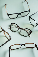 Stylish eyeglasses on colored background. Optical store, vision test, stylish glasses concept.