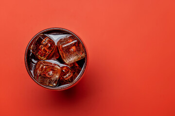Refreshing glass of cola with ice