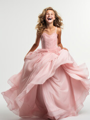 10-year-old girl dressed in pink princess dress playing princess laughing happily at the camera, isolated on plain white background