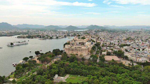 Udaipur, India: Aerial view of city in Rajasthan, famous City Palace of Udaipur and Lake Pichola - landscape panorama of South Asia from above