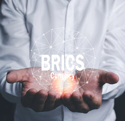 Businessman embracing globe icon New cryptocurrency concept Cooperation of 7 superpowers begins Make a cooperation agreement to use the new currency to trade internationally.