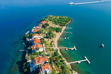 Beachfront villas on private island in Aegean sea for luxury holiday, Aerial view