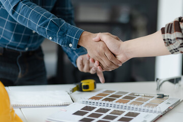 Asian engineer team and architects working designing planing of project, Engineer handshake, Home renovation concept.  