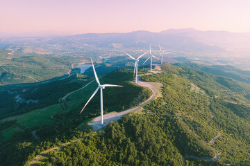 Wind turbine in wind power farm generate zero emission green energy, aerial shot