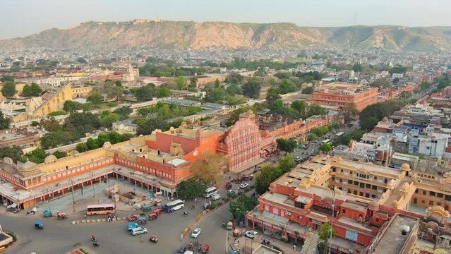 Jaipur, India: Aerial view of capital and largest city of Rajasthan, famous palace The Hawa Mahal, built from red and pink sandstone - landscape panorama of South Asia from above