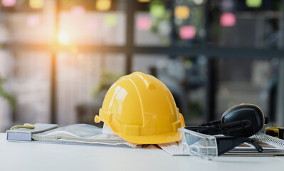 Safety helm on desk of engineer contractor, House renovation, Engineer design desk. 