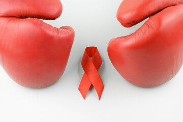 Red ribbon with boxing gloves, wrestling symbol.