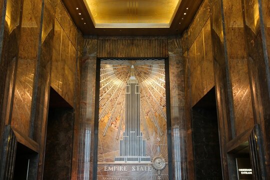 NEW YORK, USA - JULY 4, 2013: Empire State Building lobby in New York. The art-deco style 381m tall office building was the tallest building in the world for 40 years.