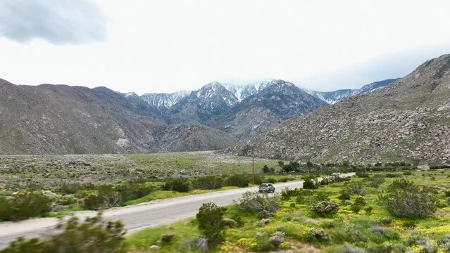 driving crv thru palm springs desert Ca with mountains on the background