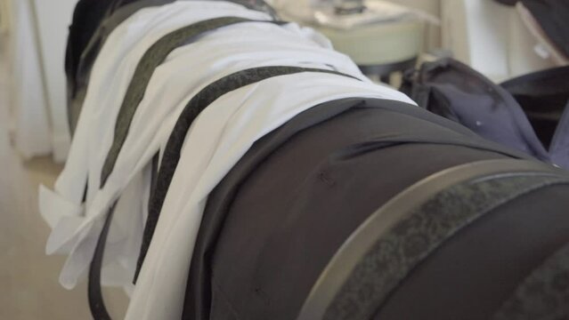 sliding shot of groom and groomsmen wedding day shirts and ties.