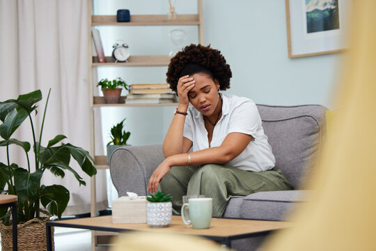 Headache, woman and stress in home with anxiety, depression and trauma of debt. Sad girl in living room with crisis, psychology problem and pain of mistake, fear and tired of mental health risk