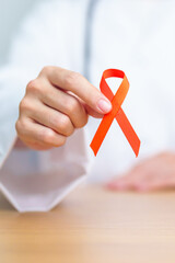Doctor with Orange Ribbon for Leukemia, Kidney cancer day, world Multiple Sclerosis, CRPS, Self...