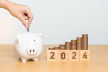 Happy New Year with piggy bank and flipping 2023 change to 2024 block. Resolution, Goals, Plan,...