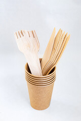 Cardboard disposable cup for coffee. Eco friendly food containers from paper. Spoons and knifes. Plastic free.