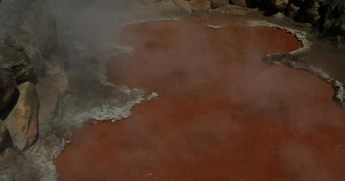 Orange thermal mud hell in Kamado jigoku cooking pot hell Beppu Japan