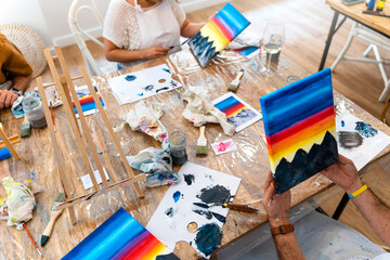 Artistic Get-Together: Friends Creating Art with Wine