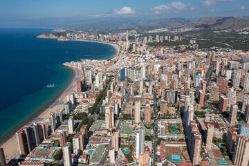 Aerial drone photo of the beautiful city of Benidorm in Spain in the summer time showing high rise...