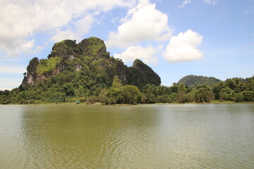 lake in Thailand with mountains in the background 