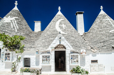 Alberobello, Italy, July 29, 2023. Old trulli houses with conical roofs in Alberobello.