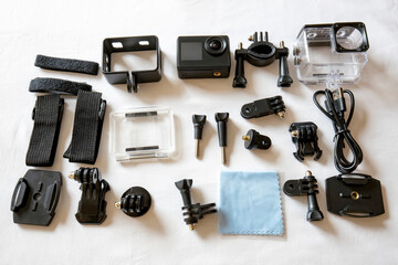 Action camera in waterproof housing and accessories