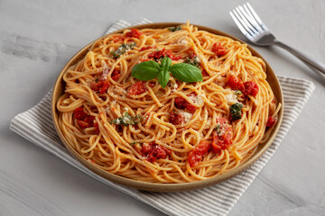 Homemade Spaghetti With Fresh Tomato Sauce on a Plate, side view.