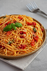 Homemade Spaghetti With Fresh Tomato Sauce on a Plate, side view.