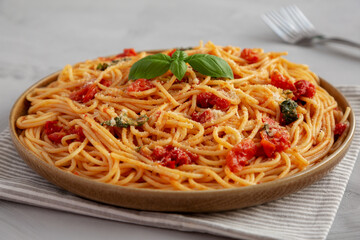 Homemade Spaghetti With Fresh Tomato Sauce on a Plate, side view.