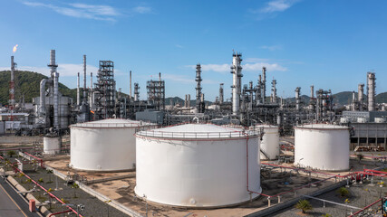 Oil​ and Gas refinery petrochemical​ plant industrial with oil and gas storage tank, White oil...