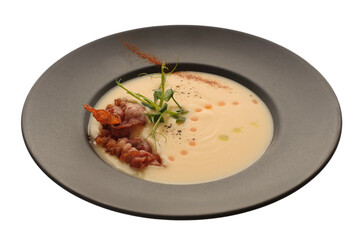 Potato cream soup with fragrant fried onions and bacon chips