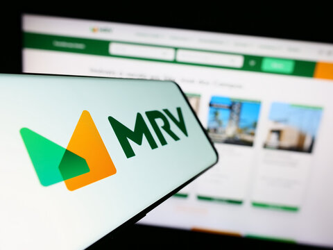 Stuttgart, Germany - 07-26-2023: Smartphone with logo of company MRV Engenharia e Participacoes SA on screen in front of business website. Focus on center-left of phone display.