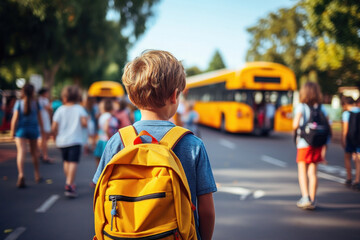 Fototapeta premium A school-aged boy dressed in his favorite t-shirt wanders toward the school bus. Warm sunny day. Back to school. Fictional person. Generated Ai