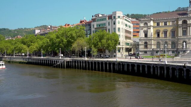 City center of Bilbao. Beautiful building architecture. View of River Nervion and his promenade area. Travel destination in North of Spain. Stabilized static video.