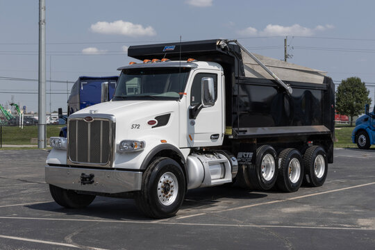 Navistar International Semi Dump Truck display at a dealership. Navistar International is subsidiary of Traton.
