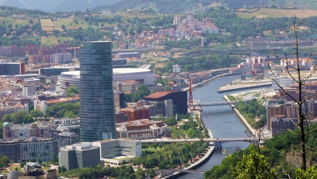 Panoramic view of Bilbao city. Perspective from above of the city. In front the old town and the river Nervion, in background the mountains that surrounding the city. 