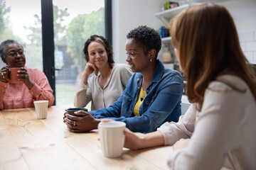 African American woman speaking in a support group being welcomed