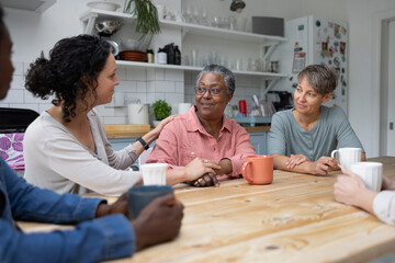 Senior african american woman being supported by a counsellor in a support group