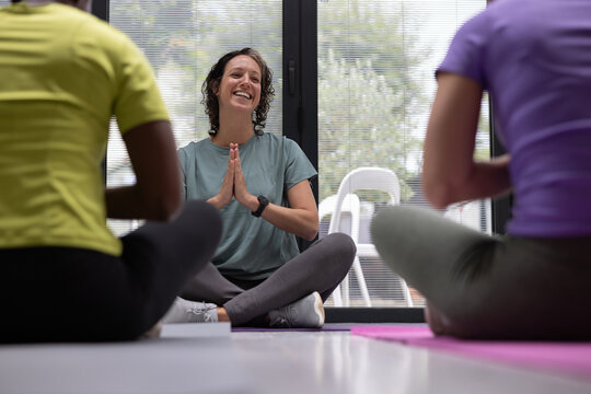 Yoga instructor thanking class of women