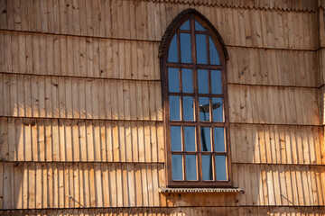Polish country side wooden Catholic church, simple and robust but traditional construction of...