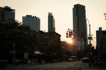 Fototapeta na wymiar The sun setting over Fulton Street in Fort Greene, Brooklyn, New York