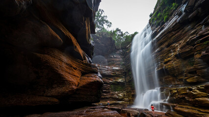 Fototapeta na wymiar Unseen Woman Entering Mosquito Waterfall in Chapada Diamantina, Brazil